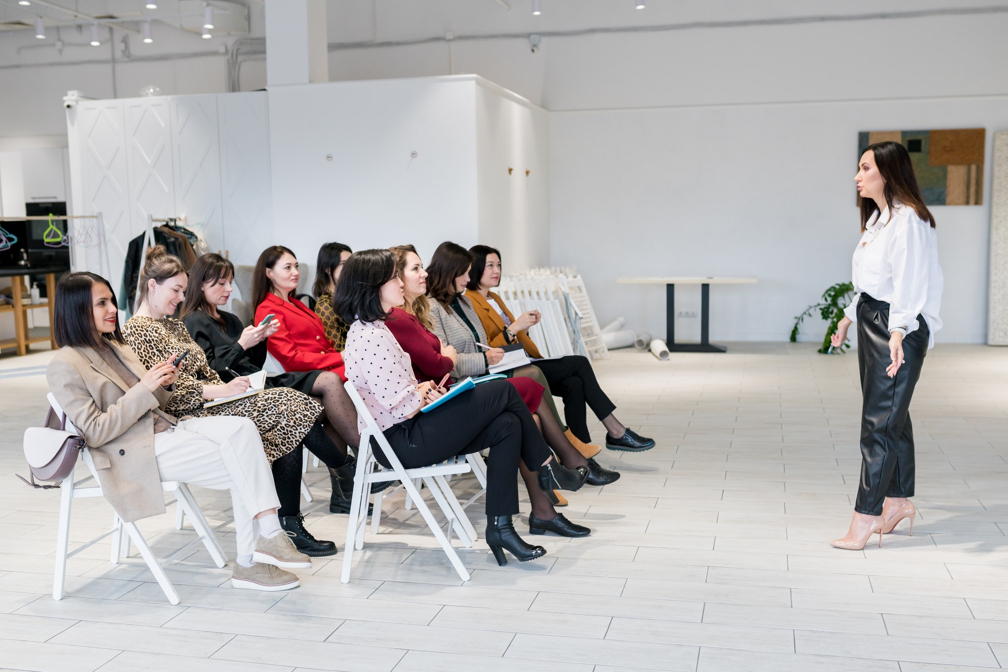 Coach having speech at business training.